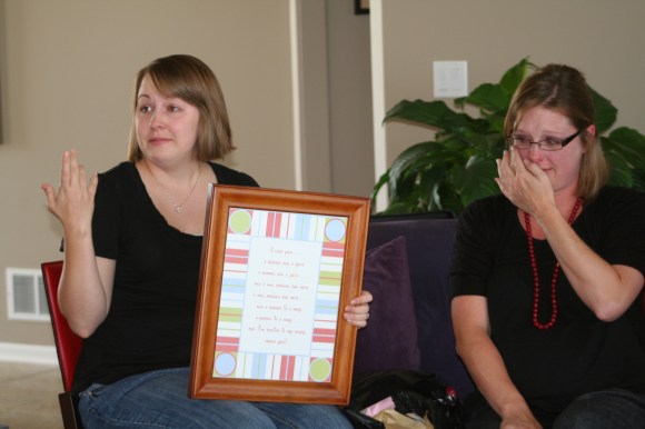 My friend, Melissa, helping me display the framed poem at my baby shower.